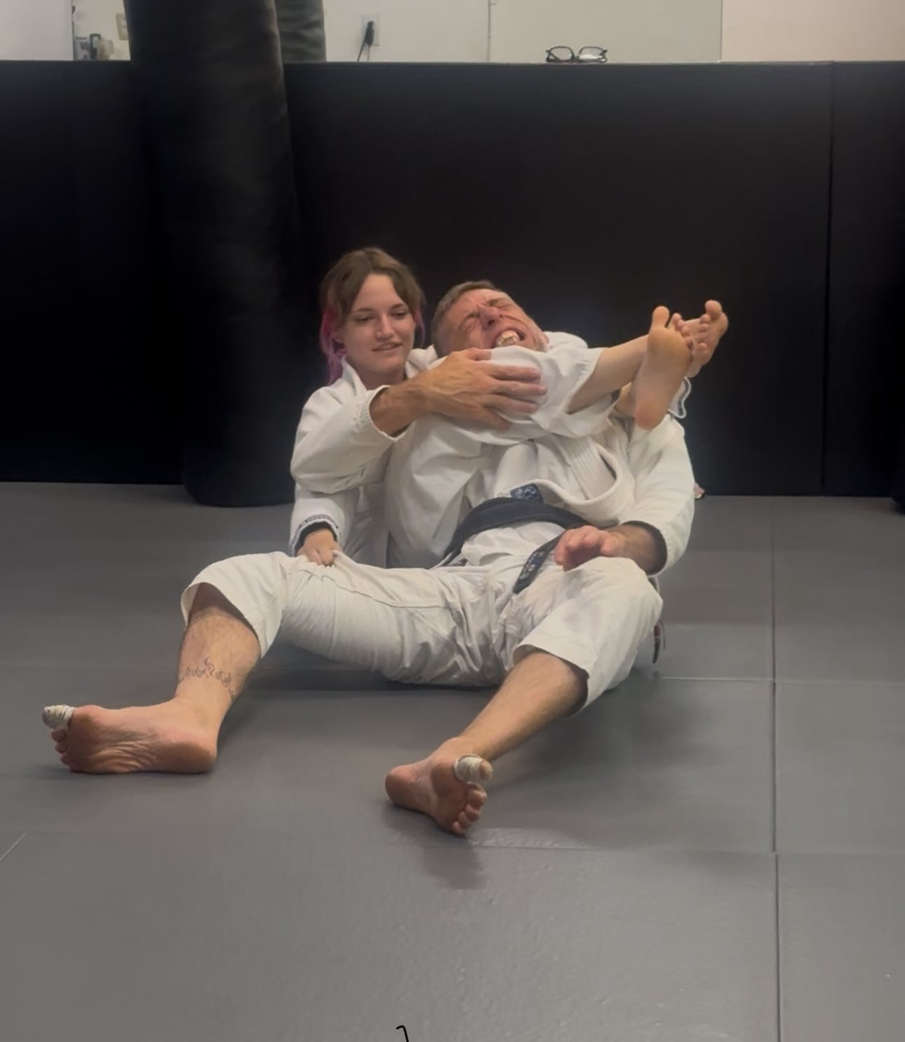 Martial arts students practicing together on the mat