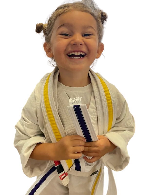 A Little Dragons age martial arts student practicing in class.